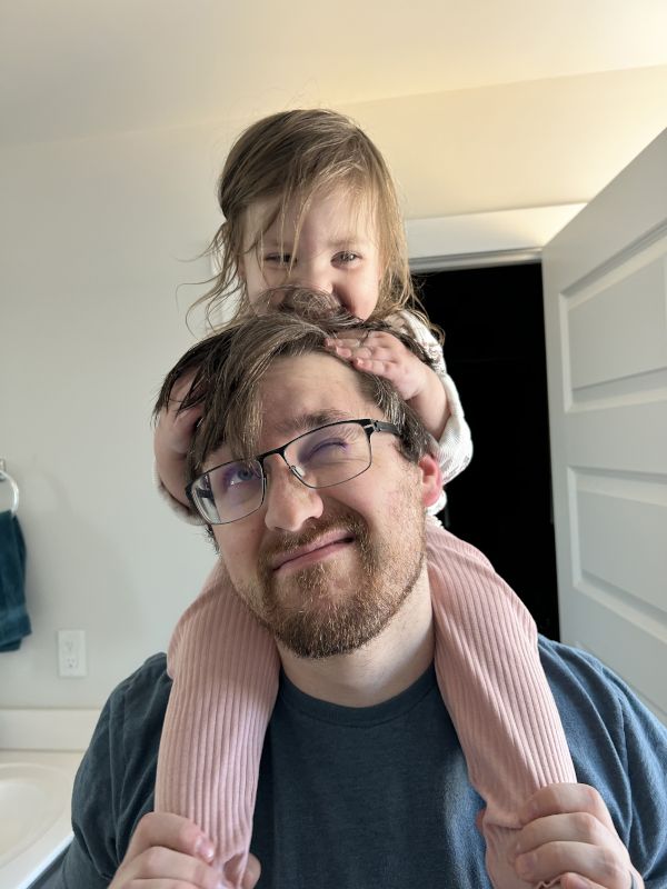 Lottie Sitting on Nick's Shoulders