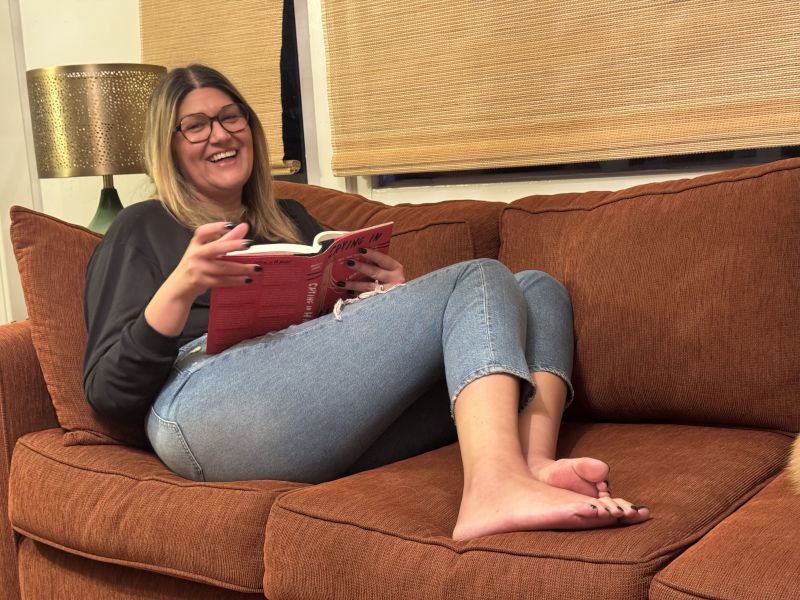 America Reading Her Book