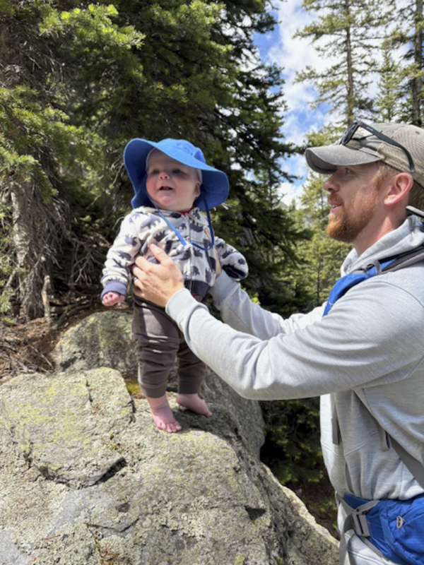 Nate and Our Son Exploring the Mountains