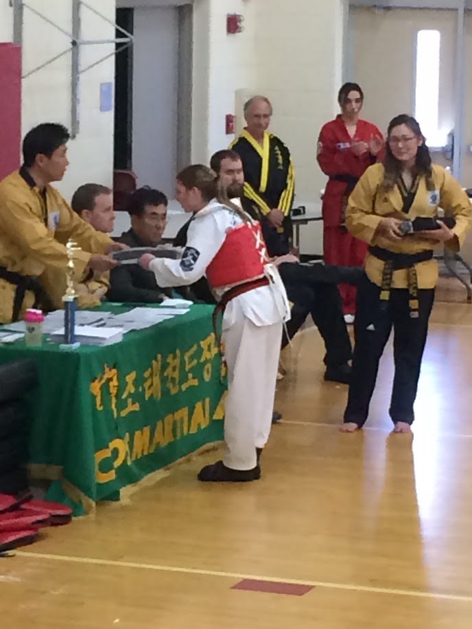 Kristin Receiving Her Black Belt