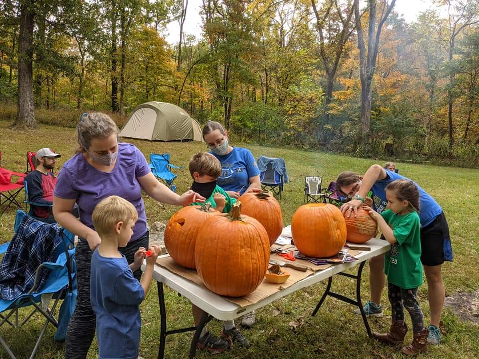 Our Family Carving Pumpkins on an October Camping Trip